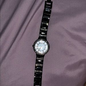 Fossil black, gold, and diamond faced watch